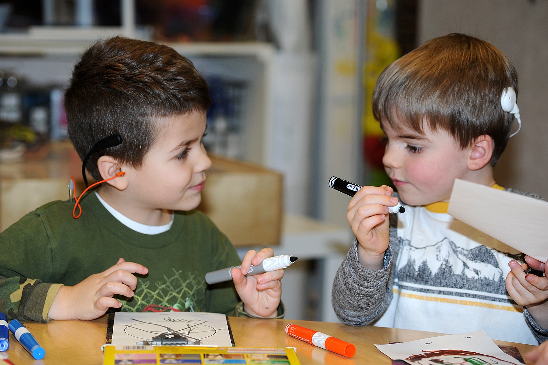 Children wearing hearing aids
