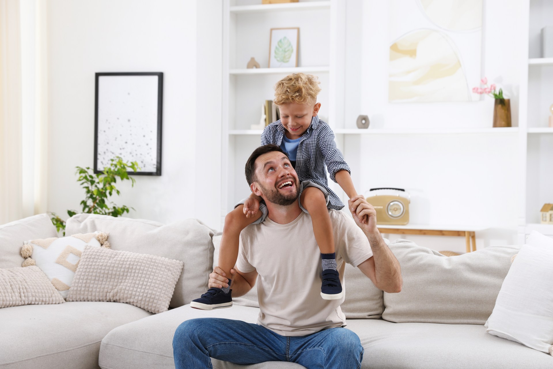 dad-holding-up-little-boy