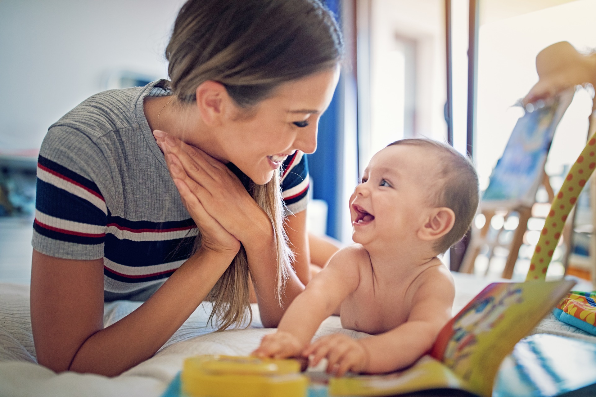 mom and baby laughing