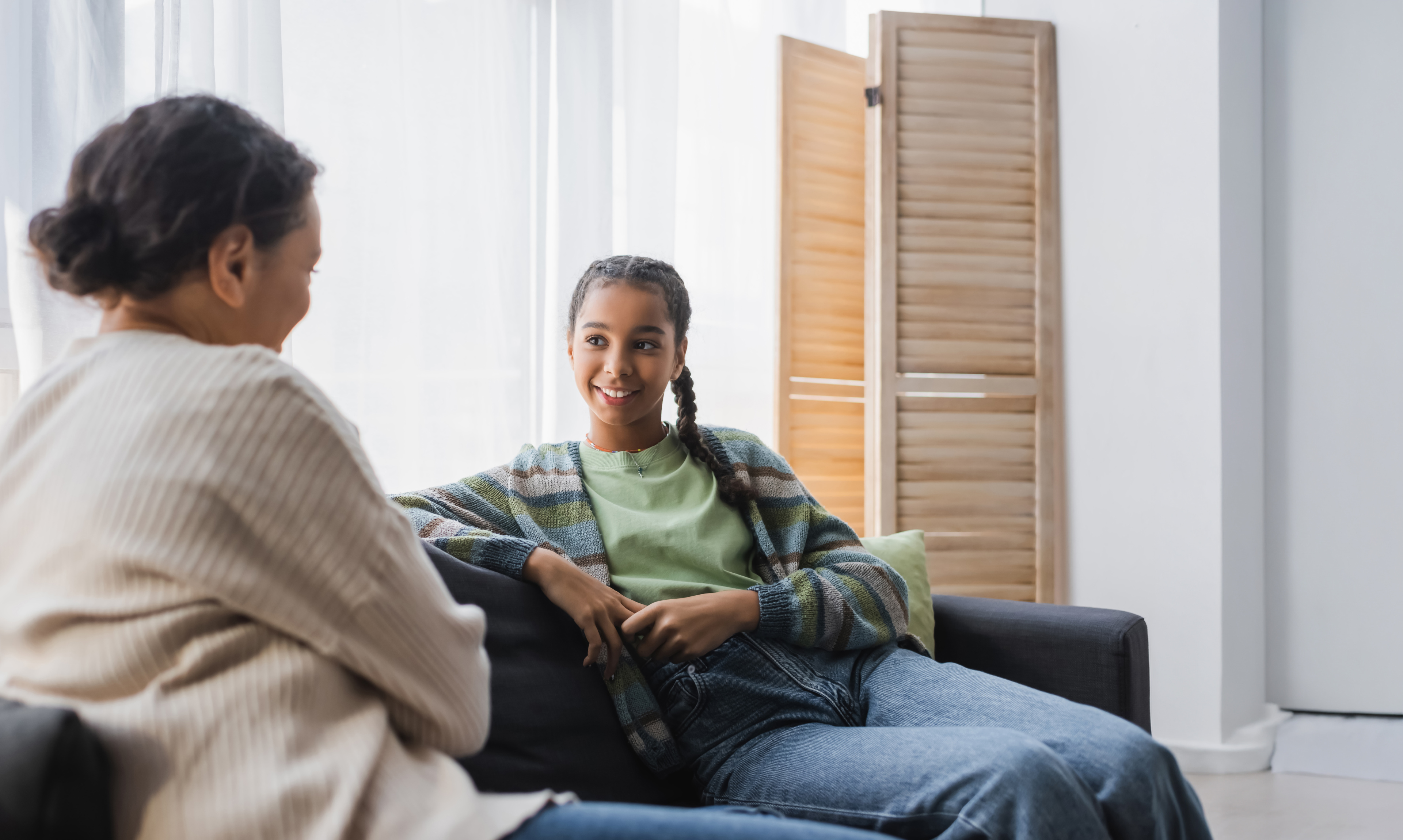 Girl talking to mom at home