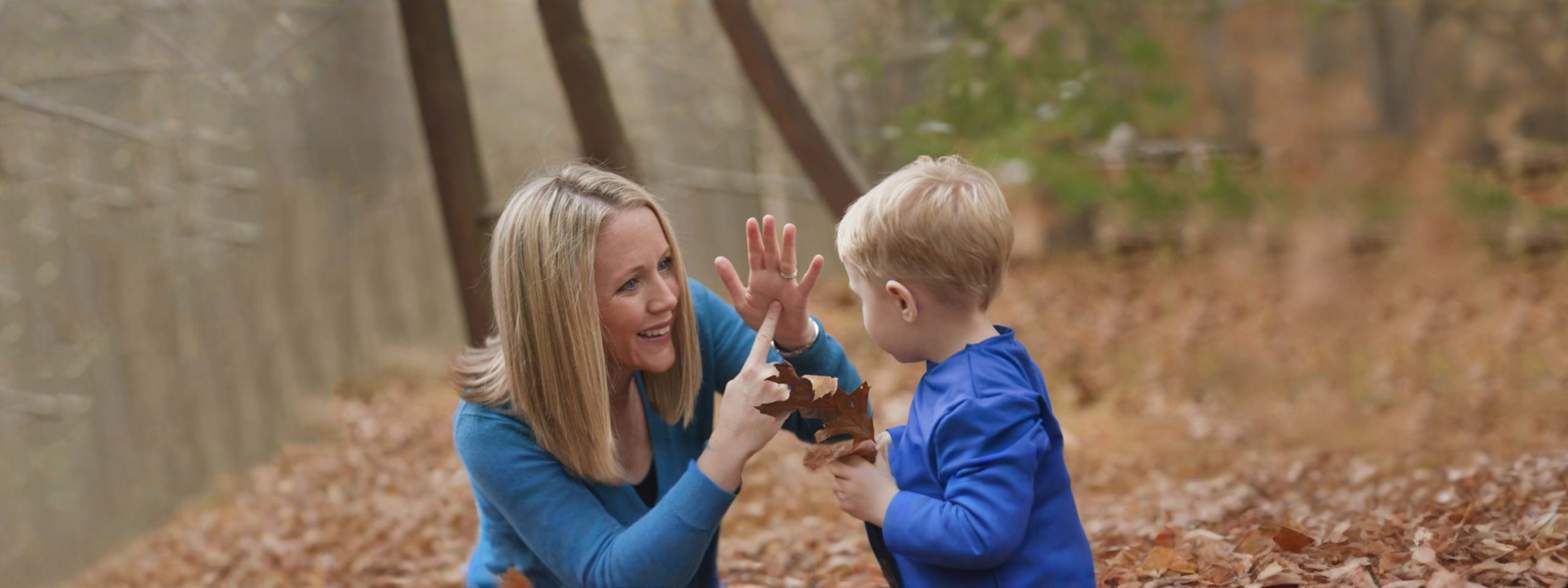 Mother and son working on sign language