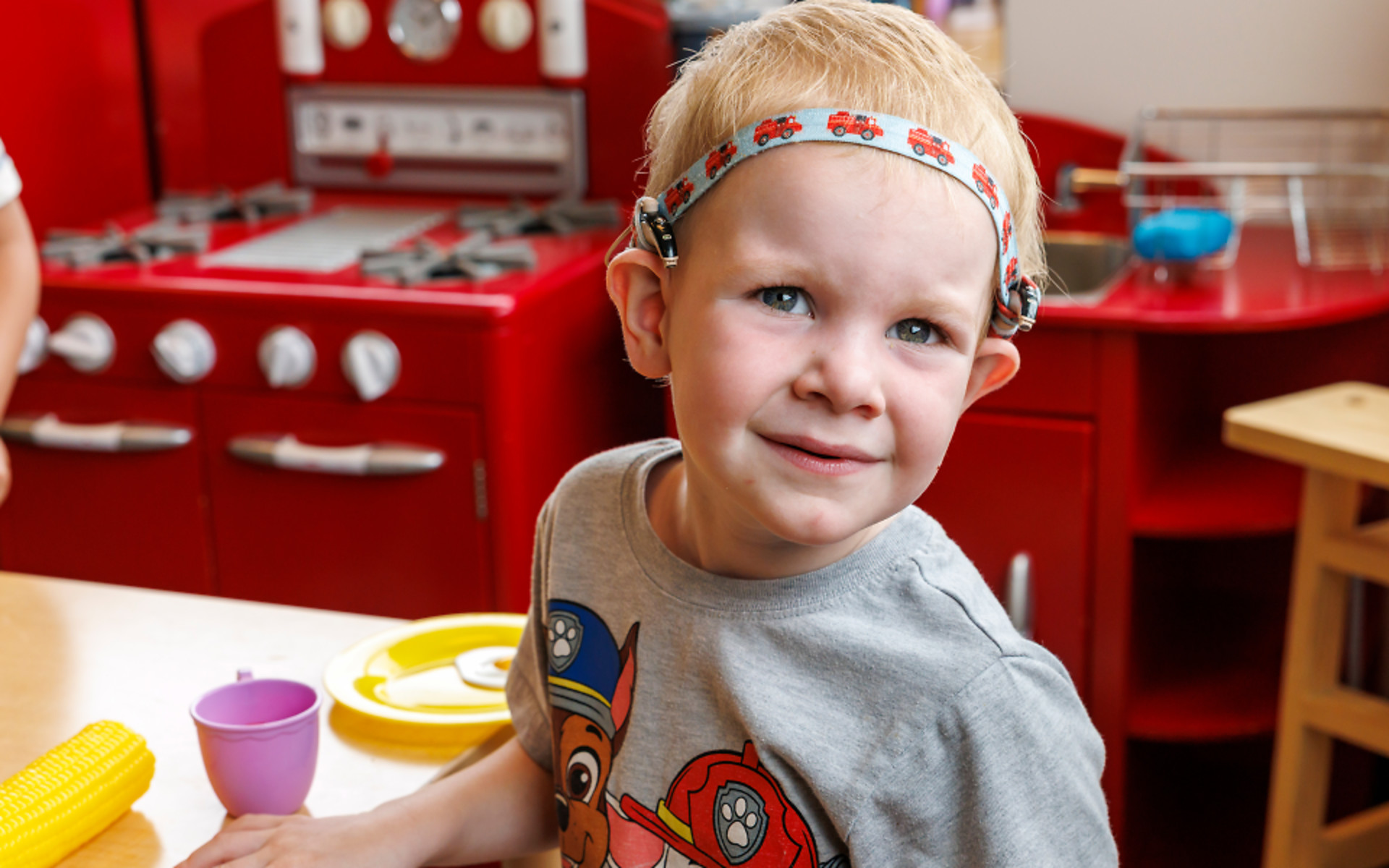Blonde haired boy with hearing aids