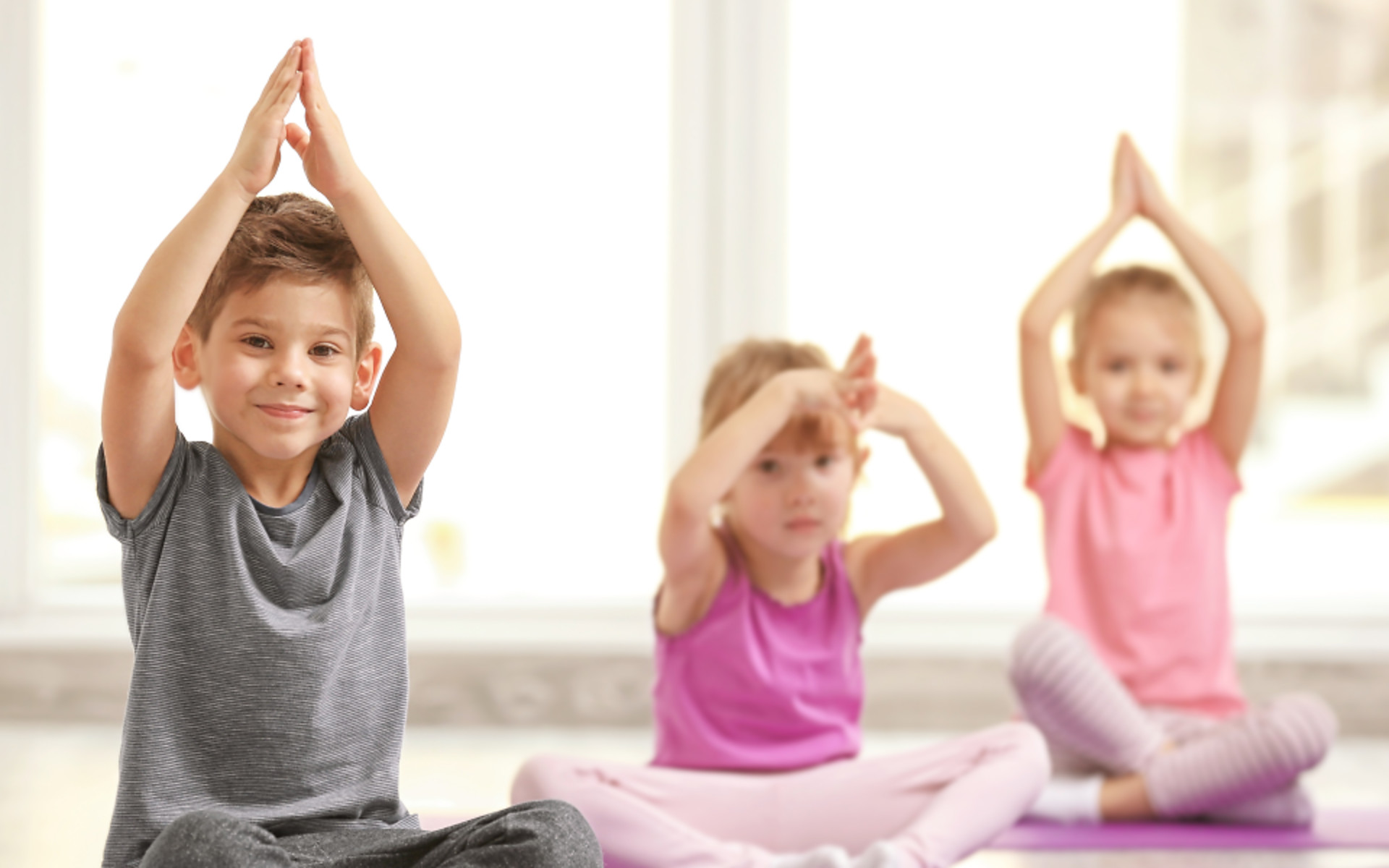 Children practicing yoga