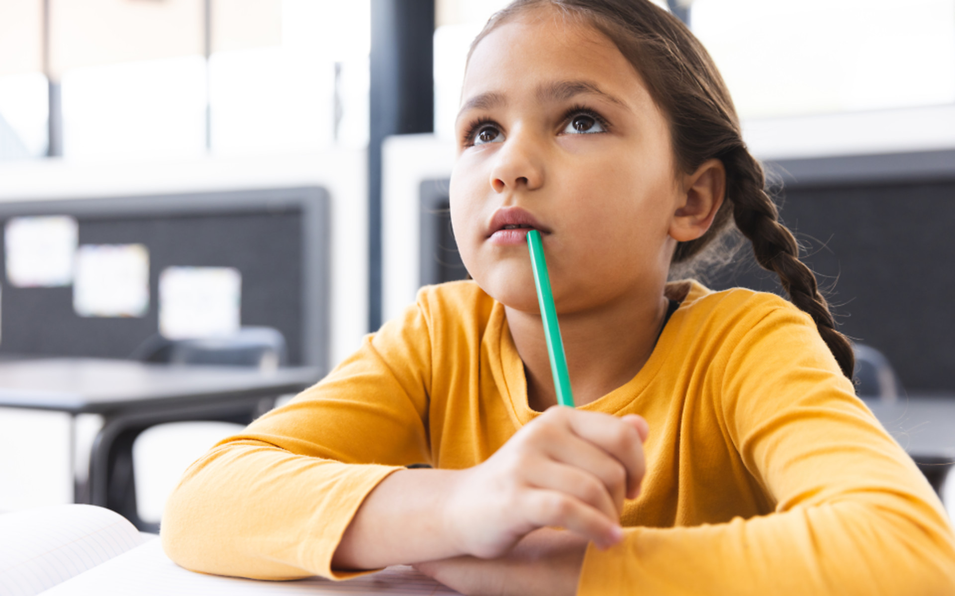 Girl thinking in classroom