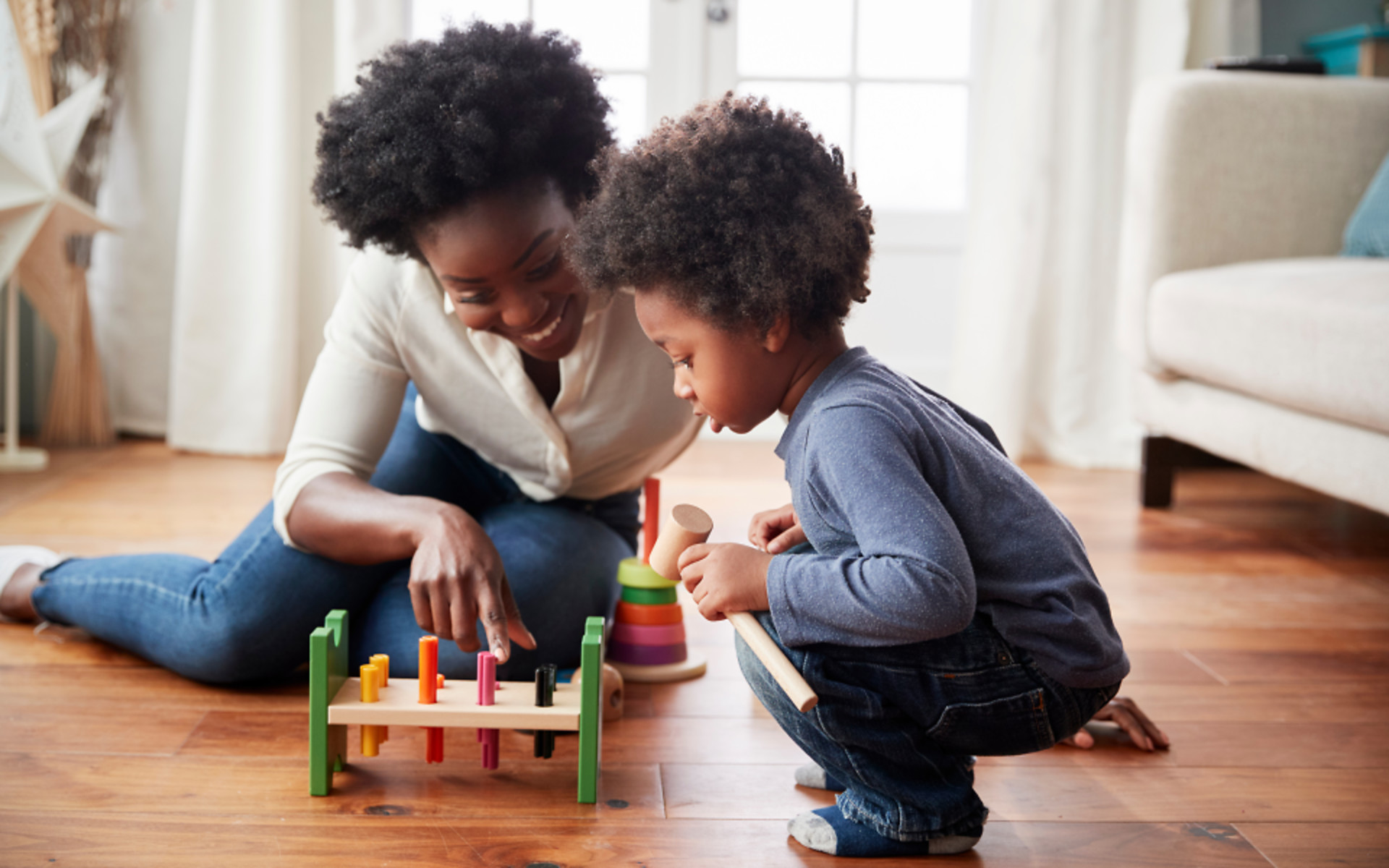 parent-young-child-playing-with-toys