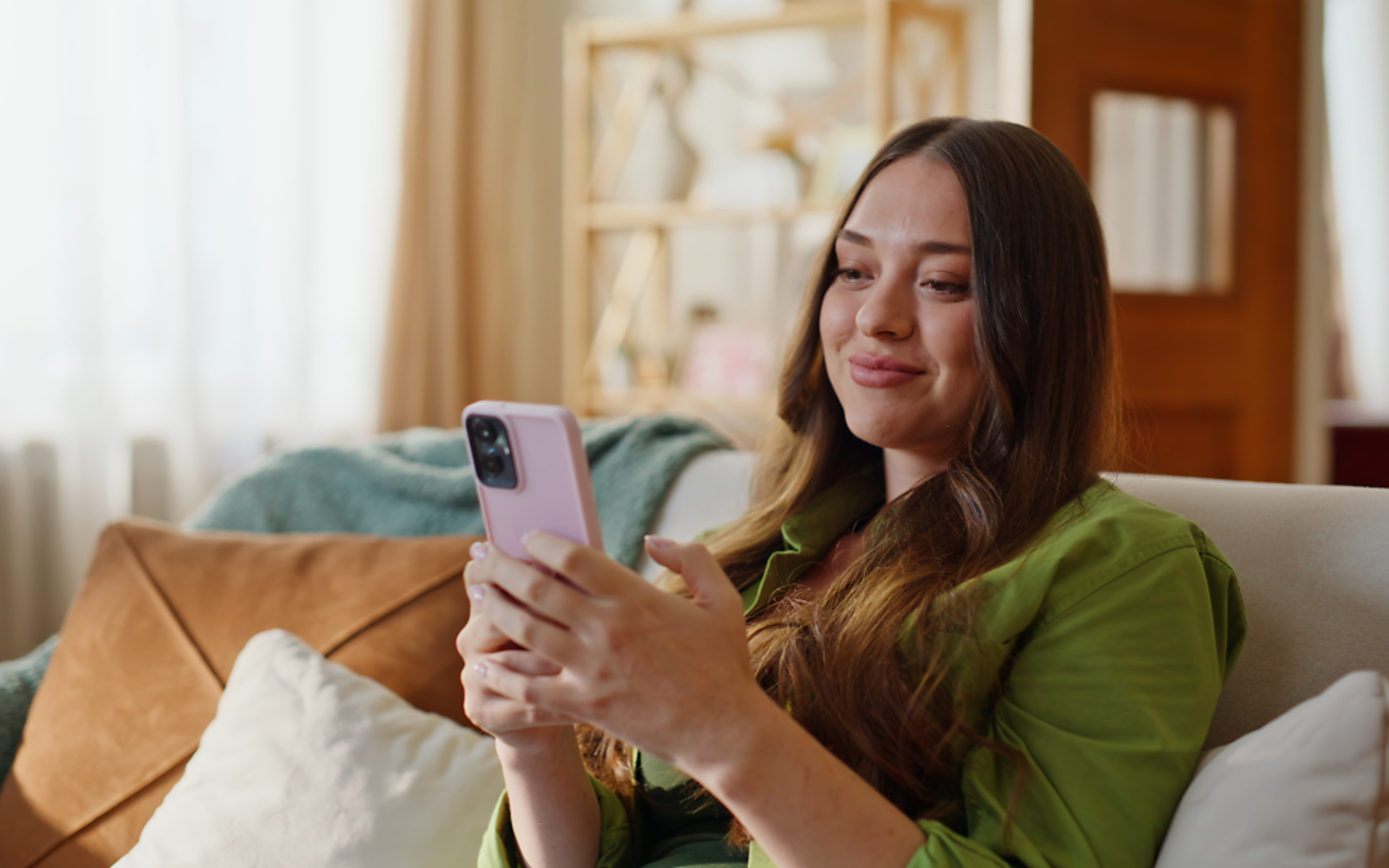 Women texting on her couch
