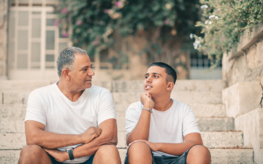 father-son-teenager-talking-outside