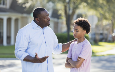 father talking to son