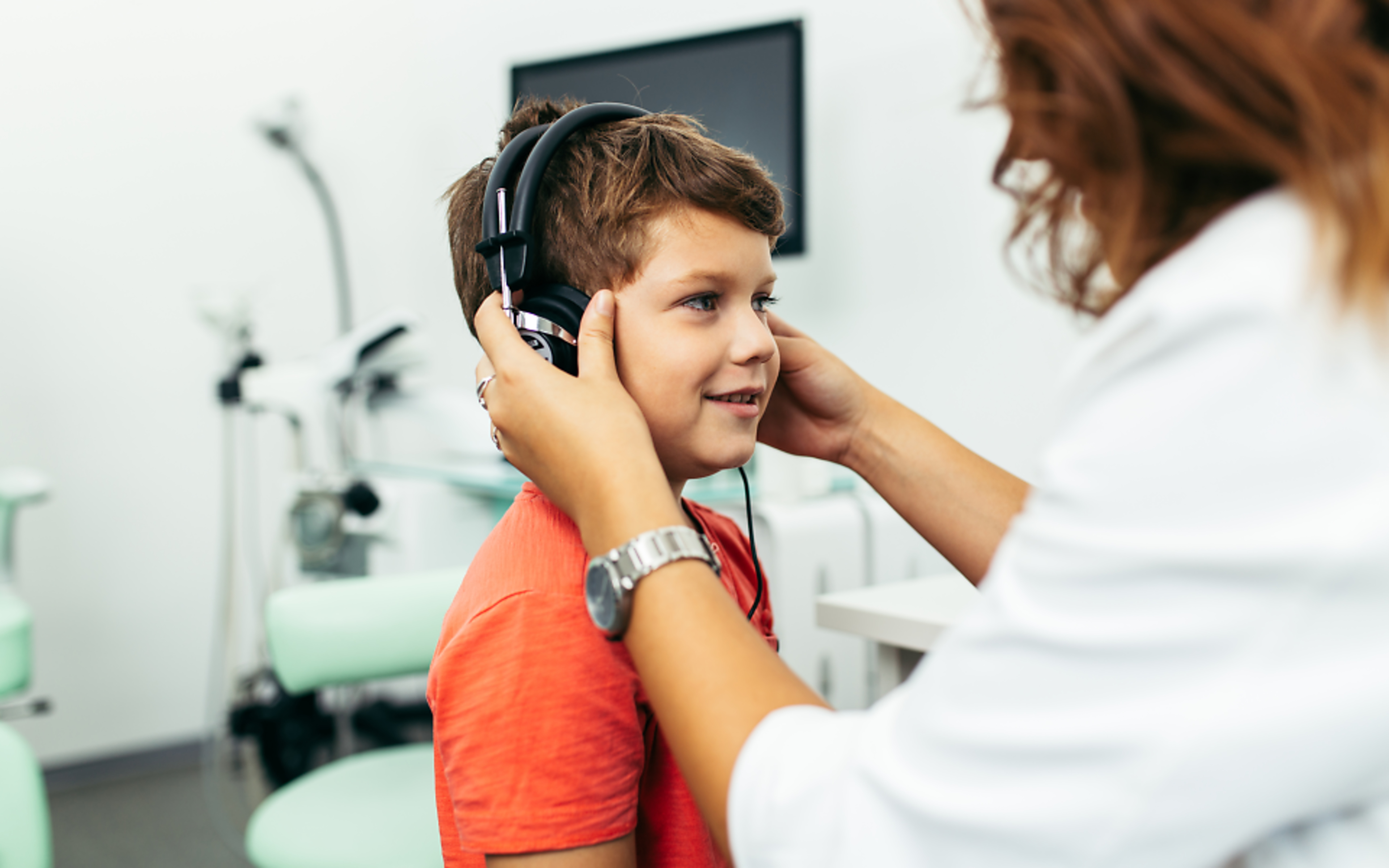Boy receiving hearing test at the clinic