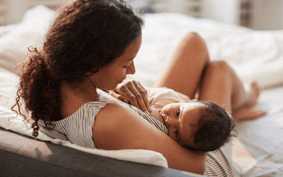 Woman breastfeeding infant