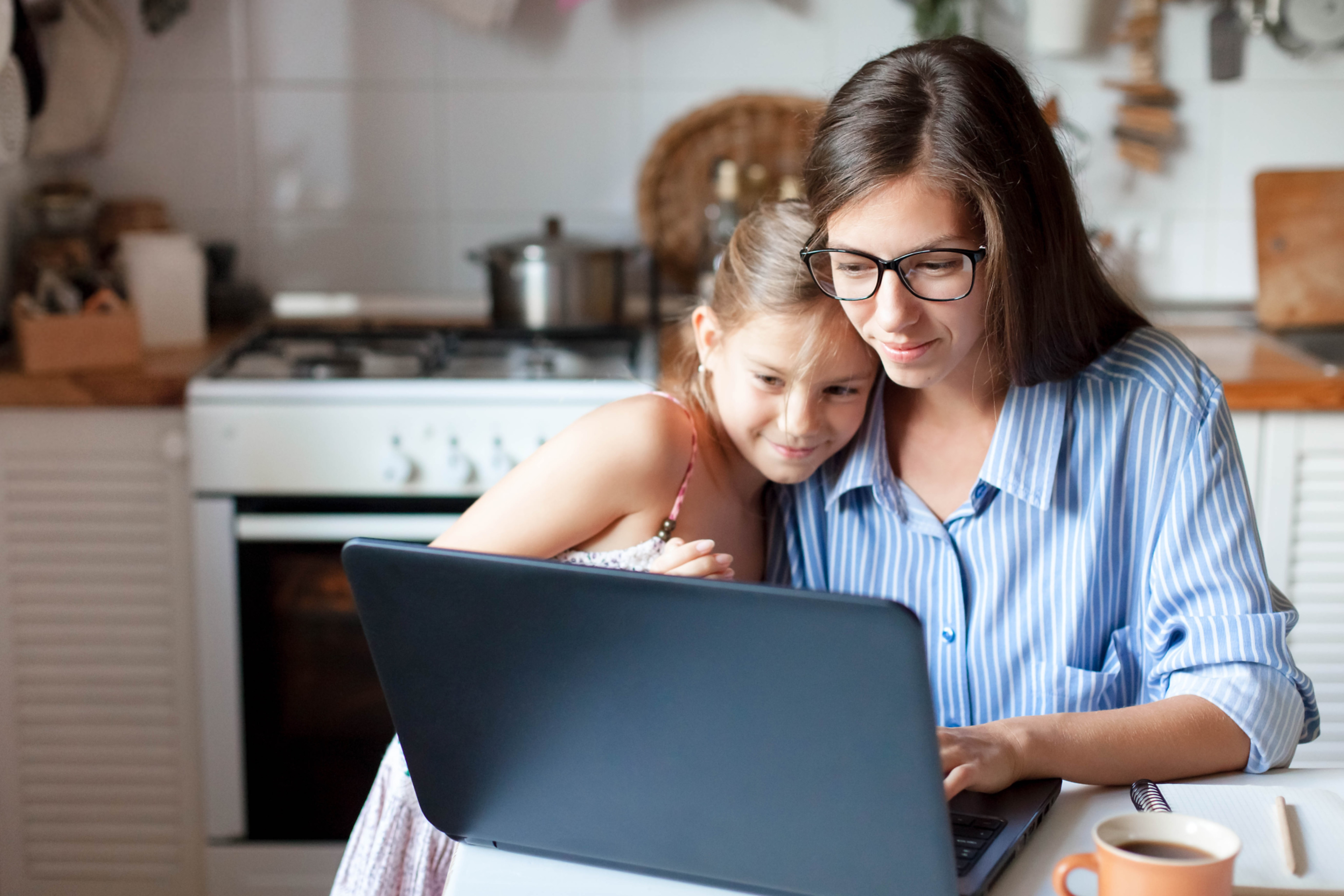 child-parent-using-technology-computer