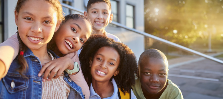 Kids taking group selfie