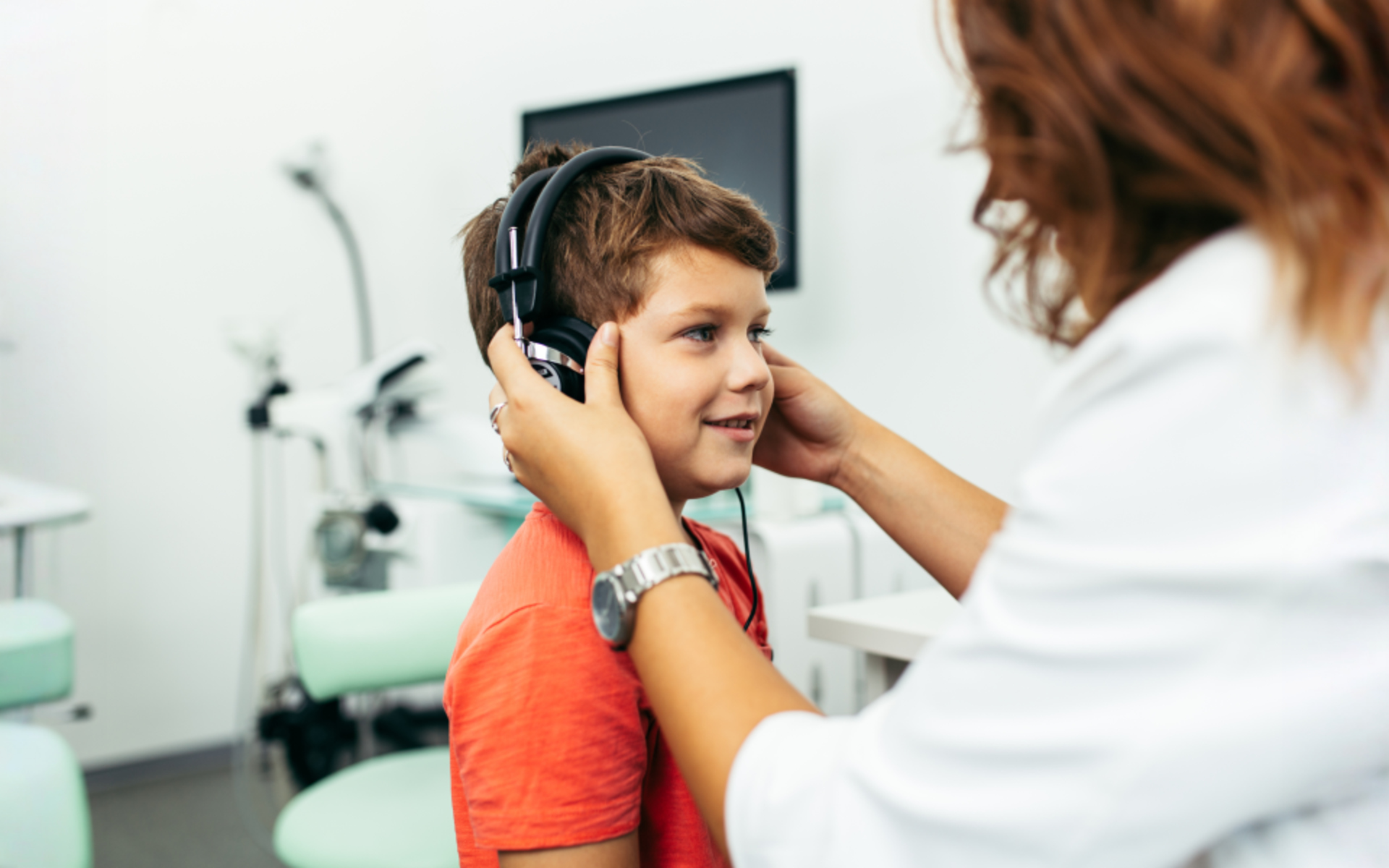 Boy receiving hearing test at the clinic